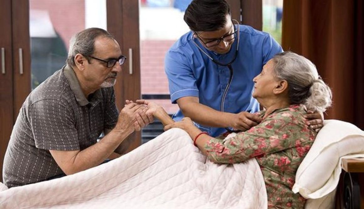 Elderly parents receiving daily care and support.
