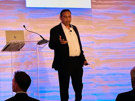 Speaker gesturing while presenting at the CHS Annual Conference
