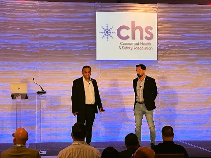Two speakers on stage at the CHS Annual Conference