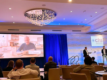 Conference session with a product demonstration on the main screen
