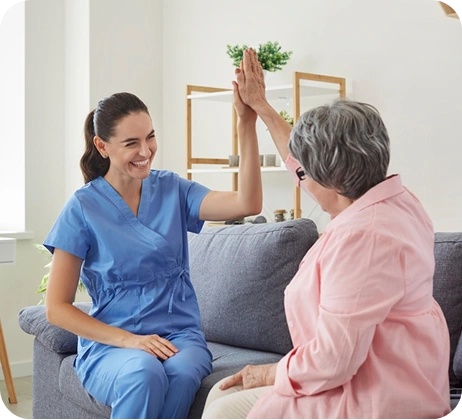 Caregiver and senior celebrating measurable care outcomes
